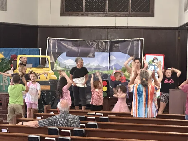 Children gathered at the front of the sanctuary for the annual Christmas program.